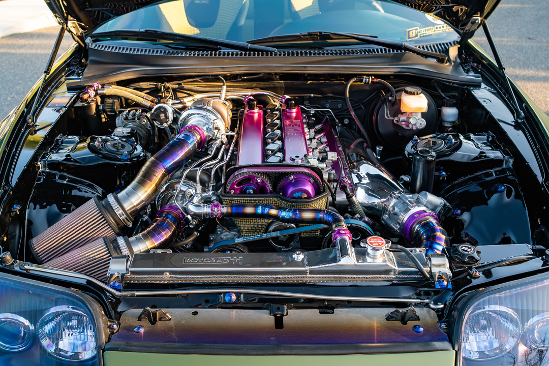 Twin-turbo 2JZ-GTE engine bay in Leopold Barrit’s 1995 Toyota Supra featuring titanium piping, Hypertune components, and BorgWarner EFR turbos.