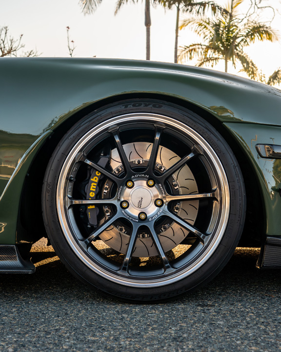 Close-up of the Advan RZ-DF2 wheel and Brembo brake setup on Leopold Barrit’s Military Olive Green 1995 Toyota Supra.