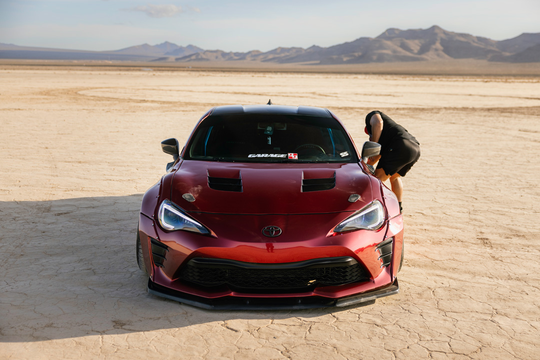 Anthony Gonzales’ red widebody Scion FR-S photographed in the desert.