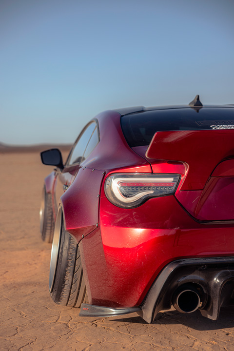 Anthony Gonzales’ red widebody Scion FR-S photographed in the desert.
