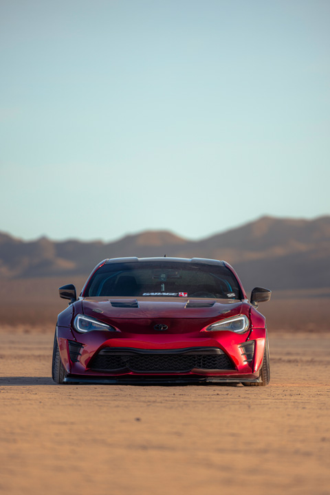 Anthony Gonzales’ red widebody Scion FR-S photographed in the desert.