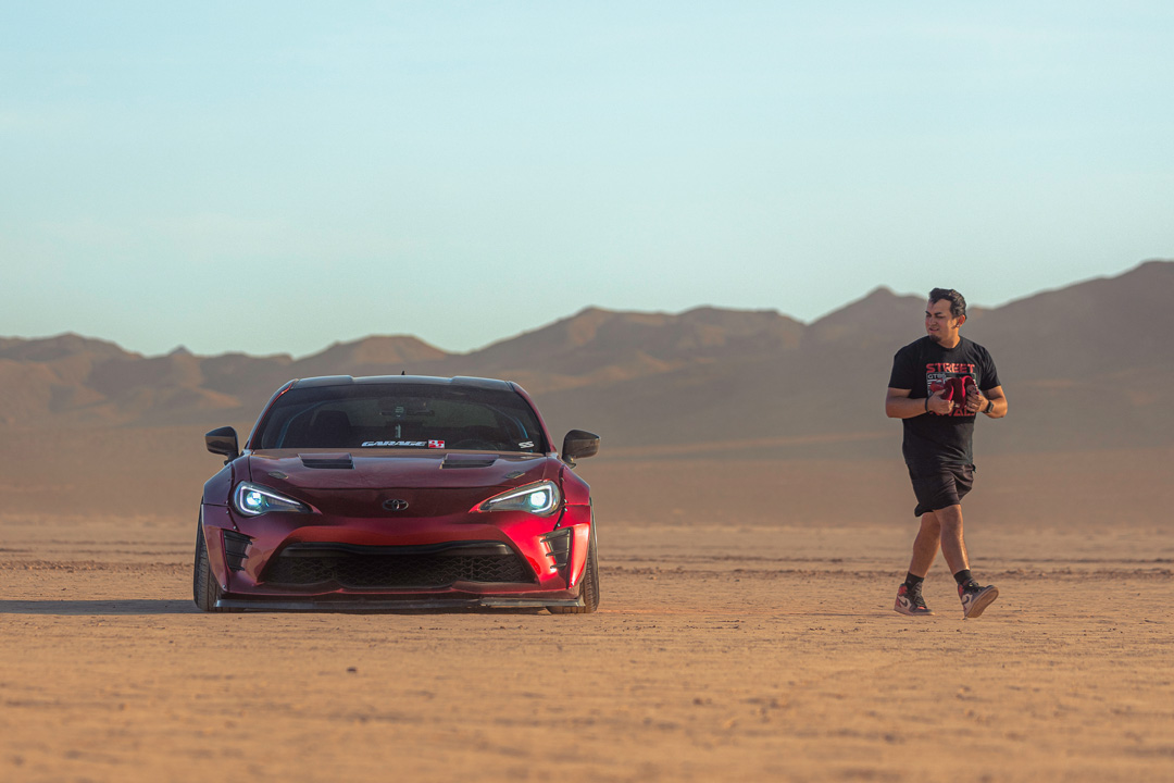Anthony Gonzales’ red widebody Scion FR-S photographed in the desert.