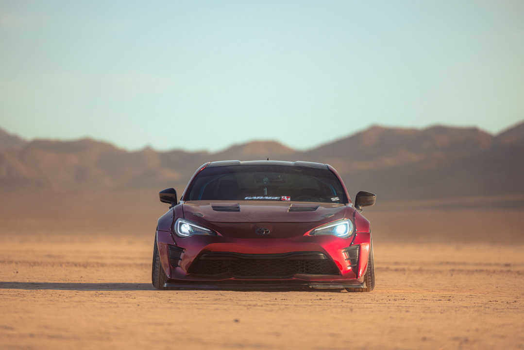 Anthony Gonzales’ red widebody Scion FR-S photographed in the desert.