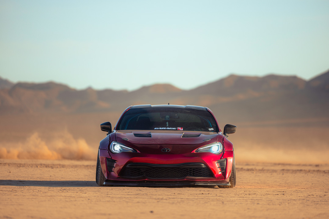 Anthony Gonzales’ red widebody Scion FR-S photographed in the desert.