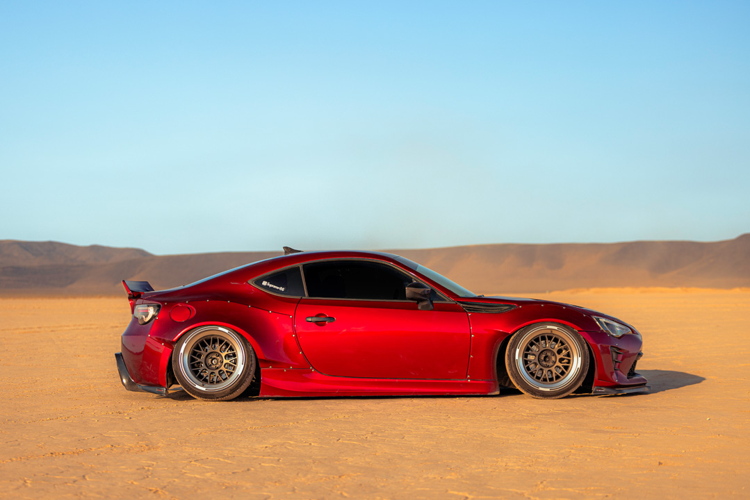 Anthony Gonzales’ red widebody Scion FR-S photographed in the desert.