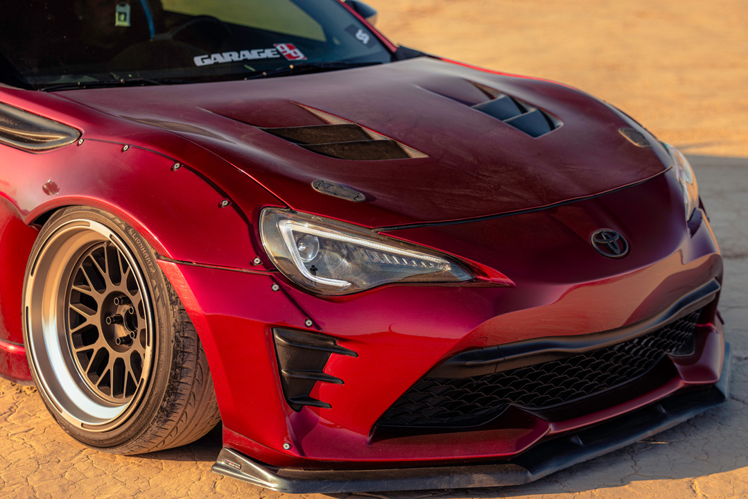 Anthony Gonzales’ red widebody Scion FR-S photographed in the desert.