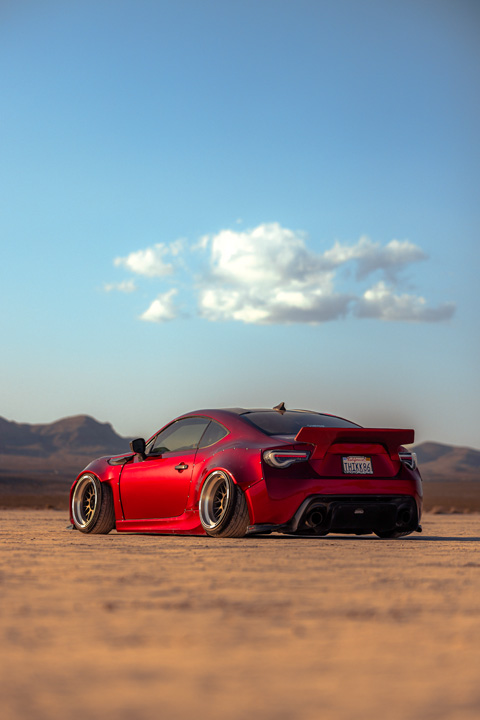 Anthony Gonzales’ red widebody Scion FR-S photographed in the desert.