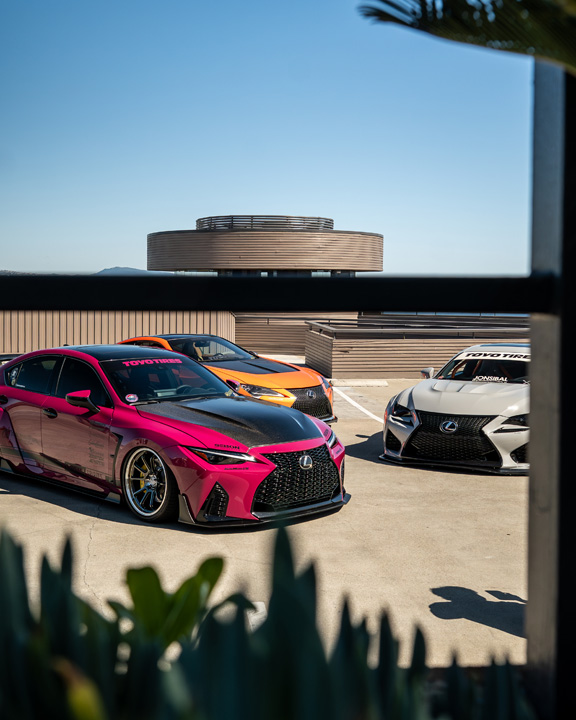 The Balthasar family’s three custom widebody Lexus builds parked together on a rooftop.