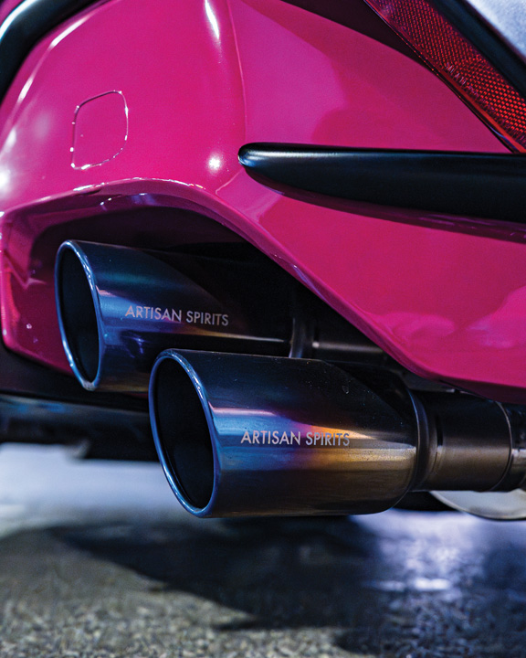 Close-up of the Artisan Spirits dual exhaust tips on Giuseppe Balthasar’s pink widebody Lexus IS 500.