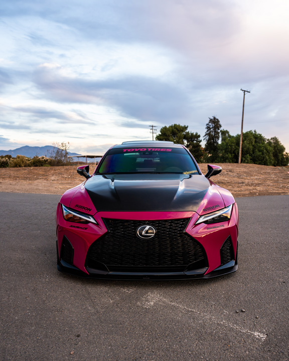 Front view of Giuseppe Balthasar’s pink widebody Lexus IS 500 with carbon hood and Toyo Tires windshield banner.