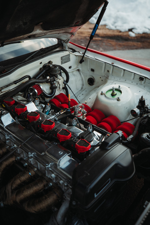 Engine bay of Gary Zackodnik’s 1988 Toyota Soarer showing the naturally aspirated 2JZ-GE swap with individual throttle bodies.