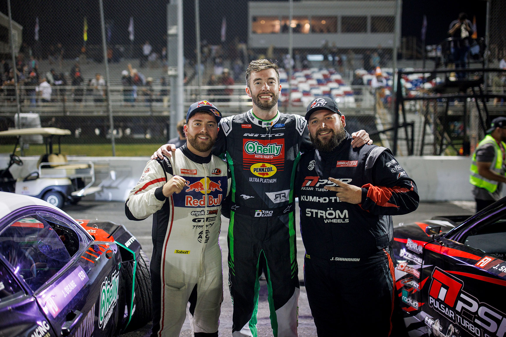 Conor Shanahan, James Deane, and Jack Shanahan celebrate an all-Irish Formula DRIFT PRO podium at Stafford Motor Speedway in 2026.