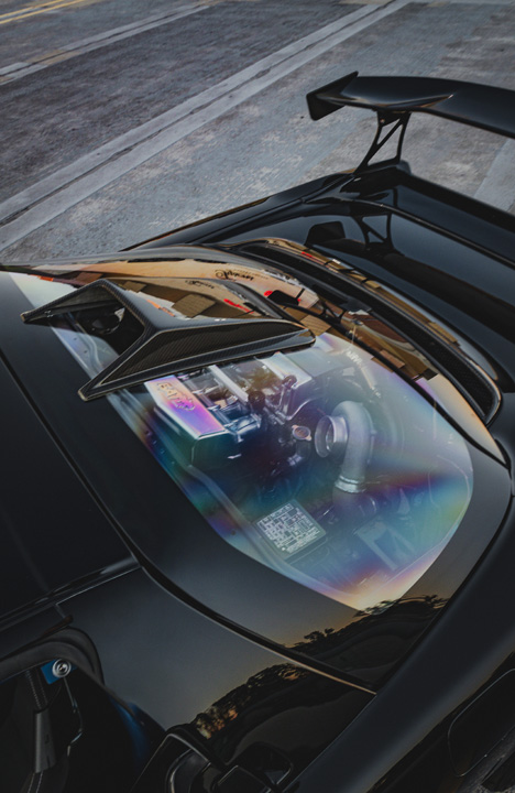 Interior detail of Peter Doan’s 1991 Honda NSX showing the blue Cusco roll cage and carbon interior trim.