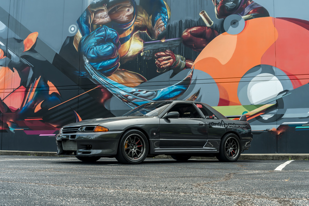 Cee Vann’s gray 1990 Nissan Skyline GT-R with high-horsepower RB30 setup, drag-focused details, and race-ready exterior and interior upgrades.