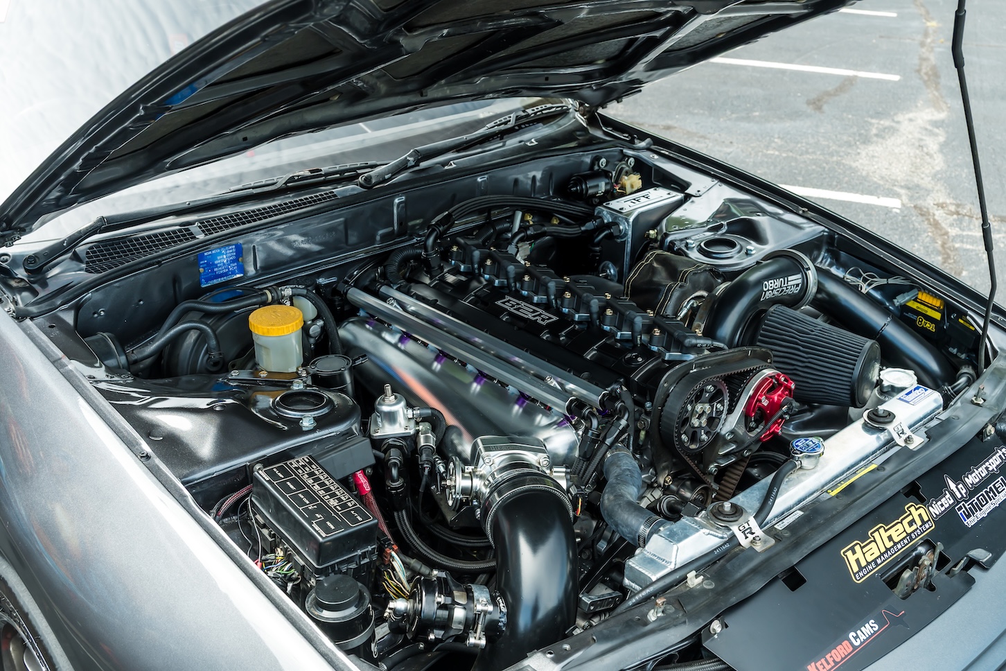 Cee Vann’s gray 1990 Nissan Skyline GT-R with high-horsepower RB30 setup, drag-focused details, and race-ready exterior and interior upgrades.