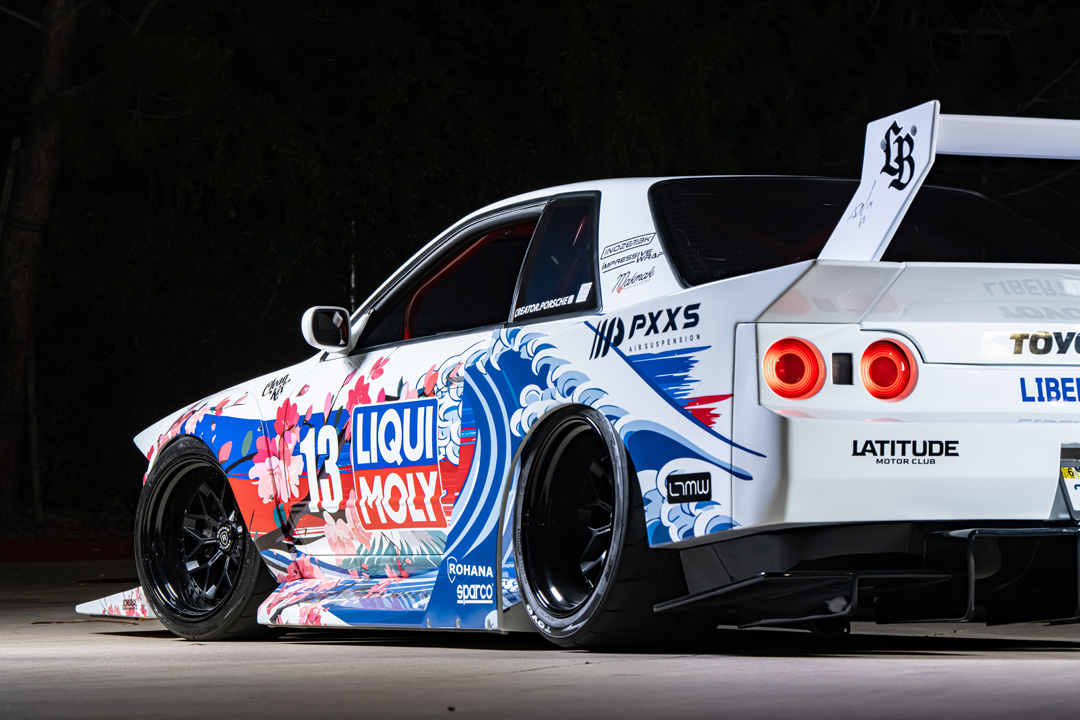 Osmond Seangsuwan’s 1990 Nissan Skyline GT-R with Liberty Walk LB-Kaido widebody aero, LIQUI MOLY livery, Rohana wheels, Toyo tires, RB26 power, carbon interior, and Japanese-inspired artwork.