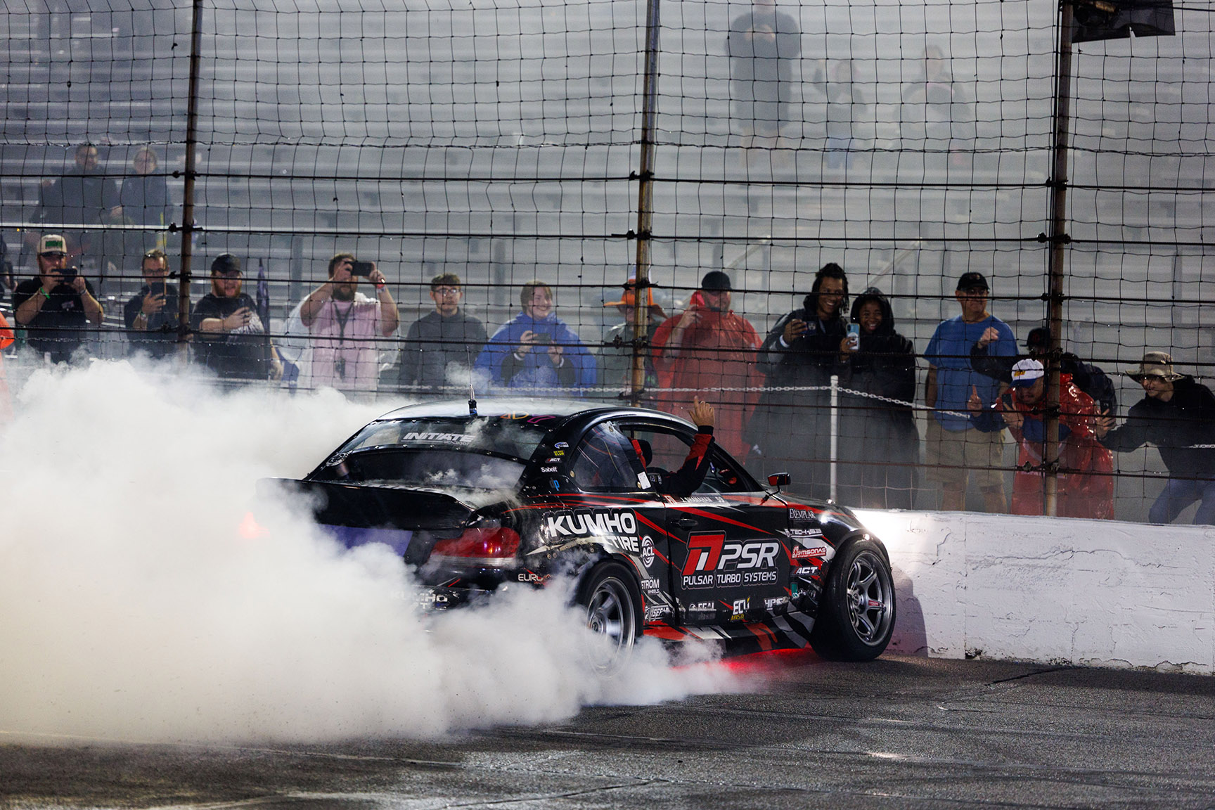 Jack Shanahan creates smoke near the wall during Formula DRIFT PRO competition at Lucas Oil Indianapolis Raceway Park in 2026.