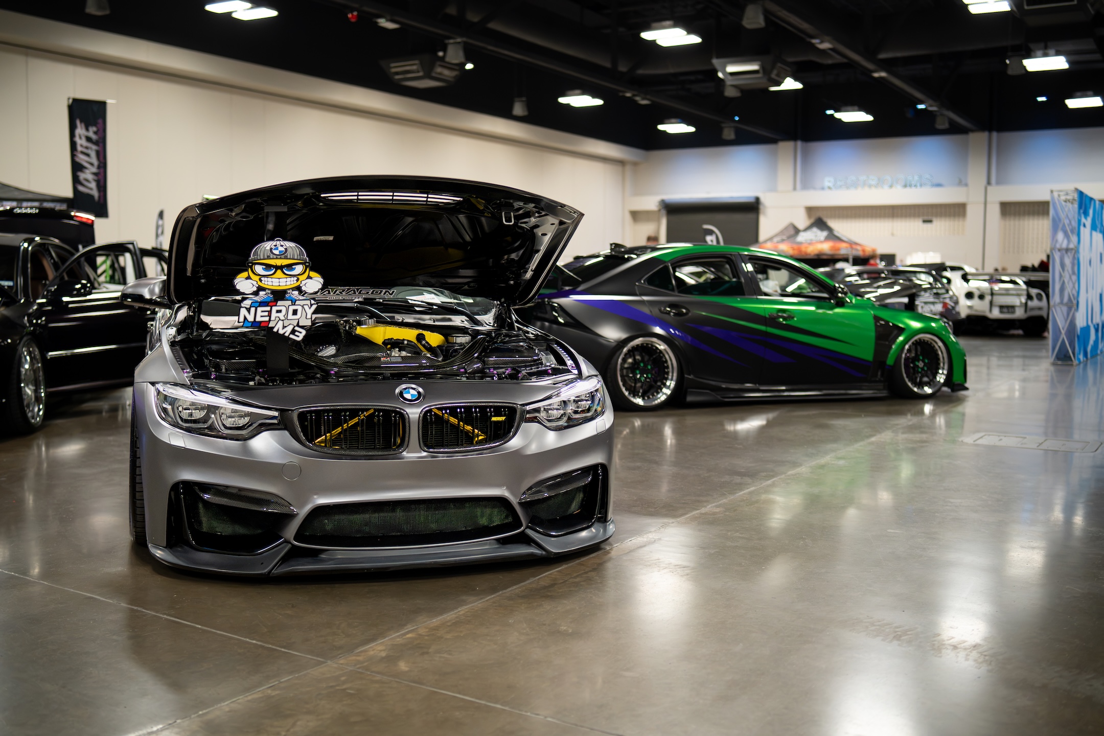 RJ Lake’s BMW and Jamie Lake’s Lexus displayed on the show floor during IMPORTEXPO Texas 2026.