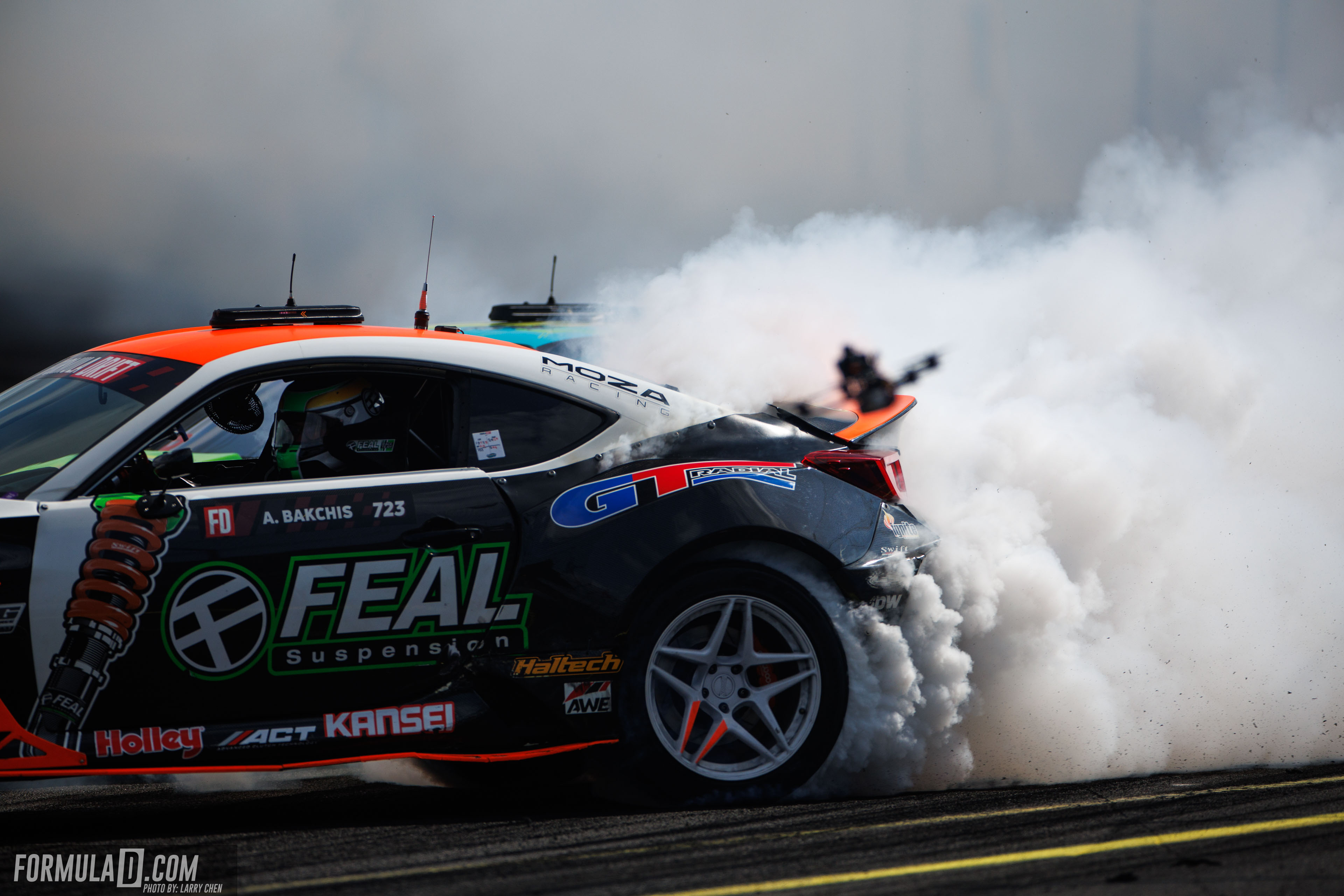 Aurimas “Odi” Bakchis drives the Feal Suspension car through smoke during Formula DRIFT PRO Round 6 at Evergreen Speedway in 2026.
