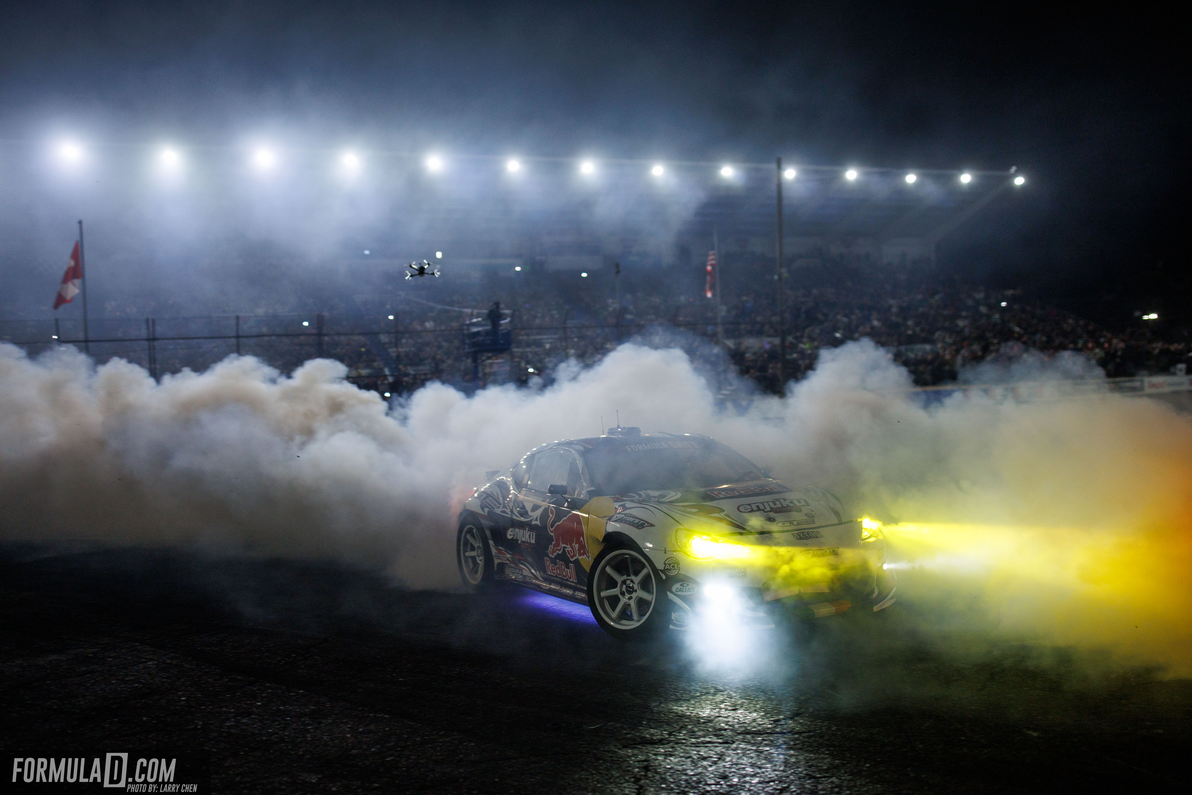 Conor Shanahan drives through smoke under the lights during Formula DRIFT PRO Round 6 at Evergreen Speedway in 2026.