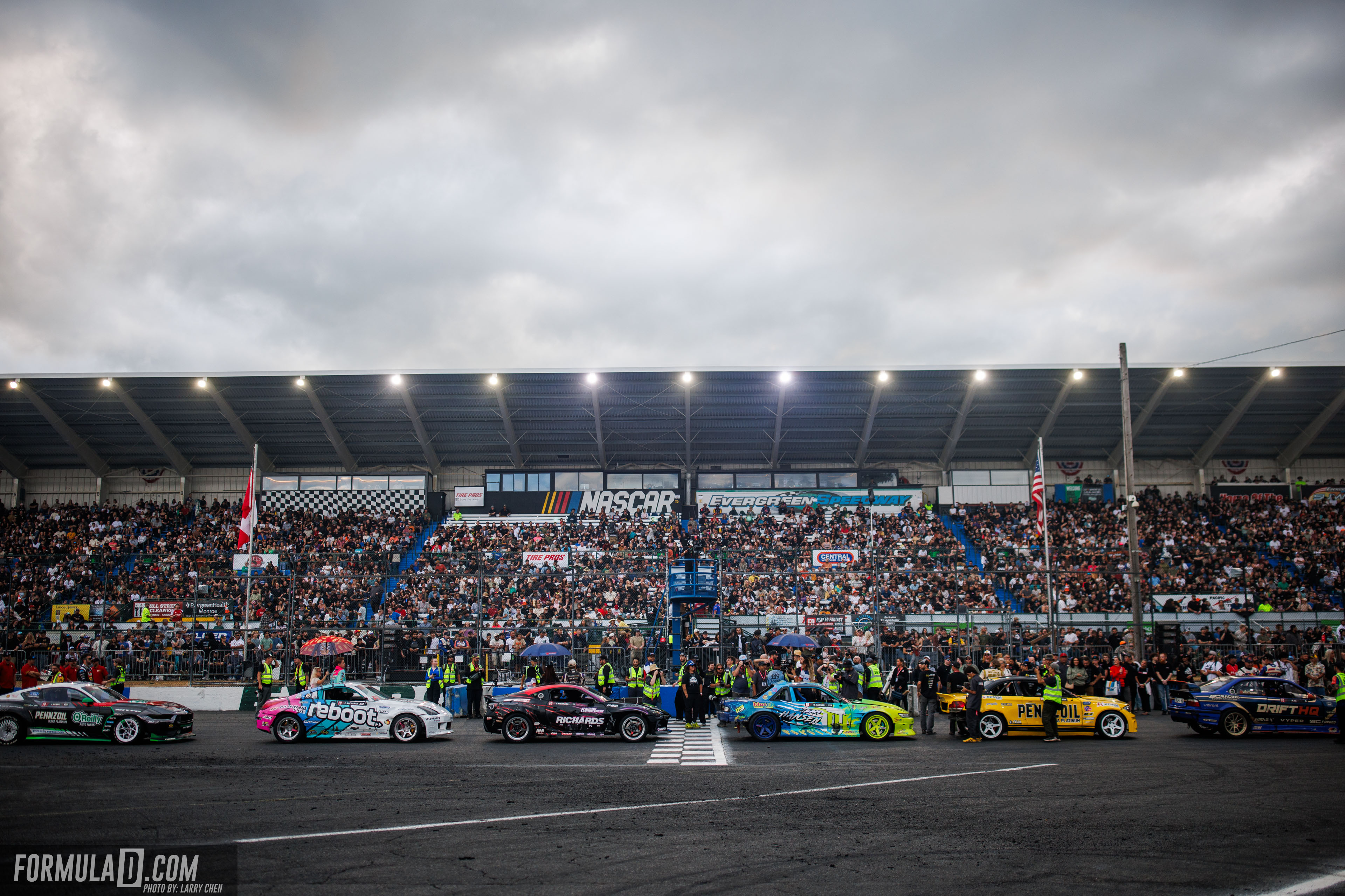Formula DRIFT PRO cars line up in front of a packed Evergreen Speedway grandstand during Round 6 in 2026.
