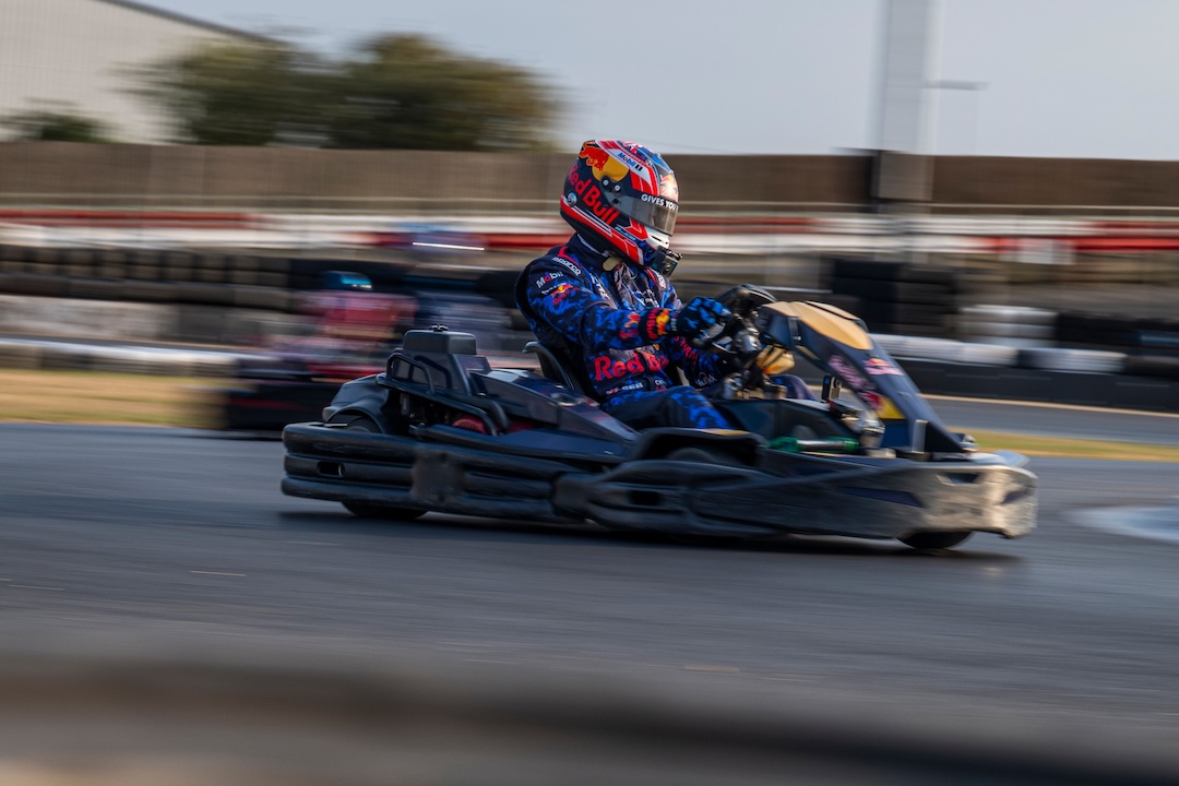 Max Verstappen drives a go-kart during preparations for Red Bull Max vs 100 at Silverstone Circuit.
