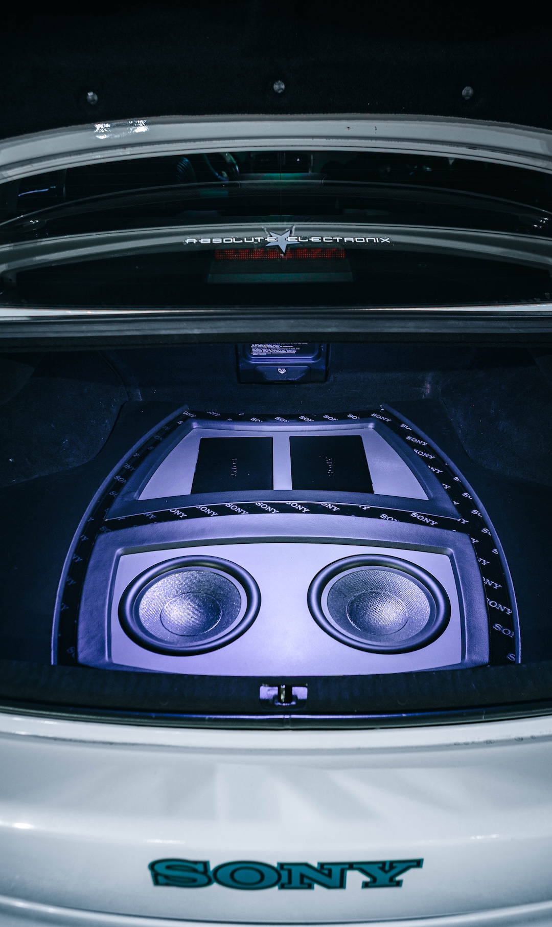 Custom audio installation in Harry Nguyen’s 2006 Lexus IS350 showing dual Sony XS-W104GS 10-inch subwoofers and XM-GS6DSP amplifiers.