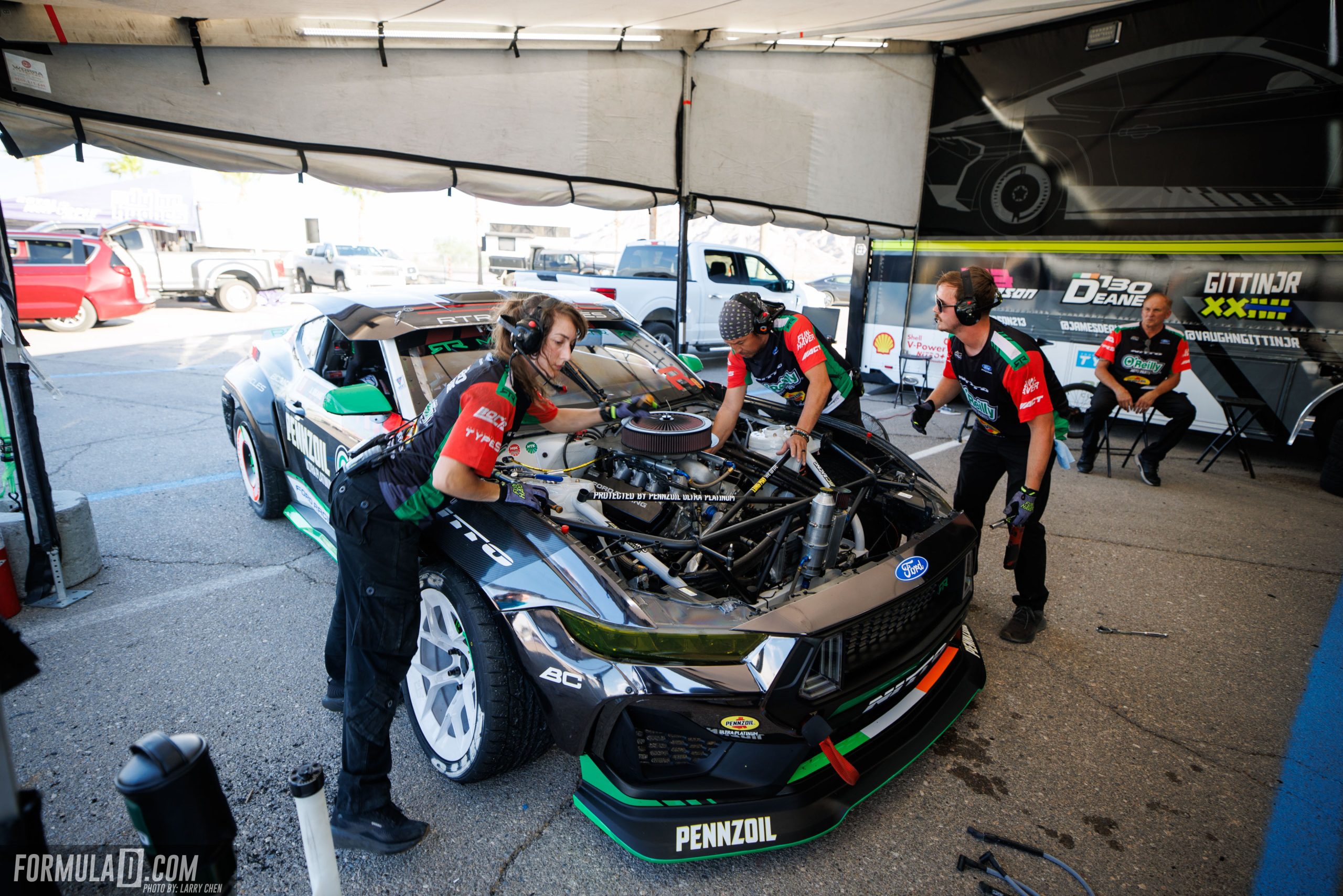 James Deane’s Ford Mustang being serviced in the pits during Formula Drift Round 7 at Las Vegas Motor Speedway.