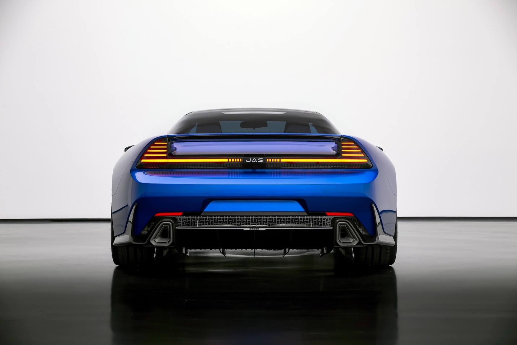 Rear view of the blue JAS Tensei Honda NSX restomod designed by Pininfarina, featuring an integrated rear wing, full-width LED taillights and rear diffuser.
