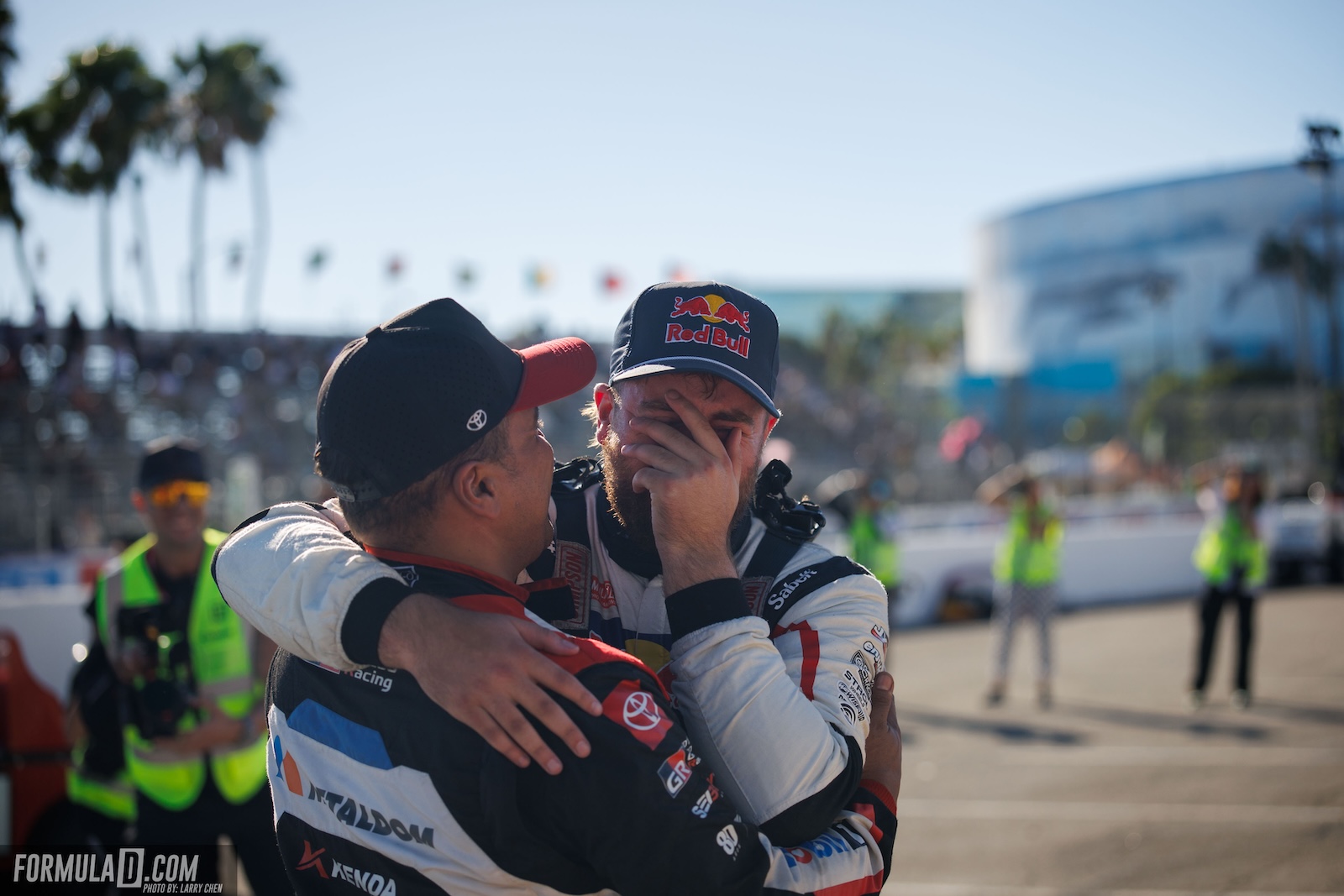 Conor Shanahan covers his face during an emotional embrace following his championship-clinching Top 32 victory at the 2026 Formula Drift PRO finale in Long Beach, California.